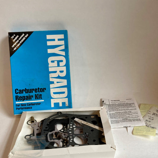 Carburetor repair kit packaging with visible gaskets and possibly some parts, placed on a white surface.
