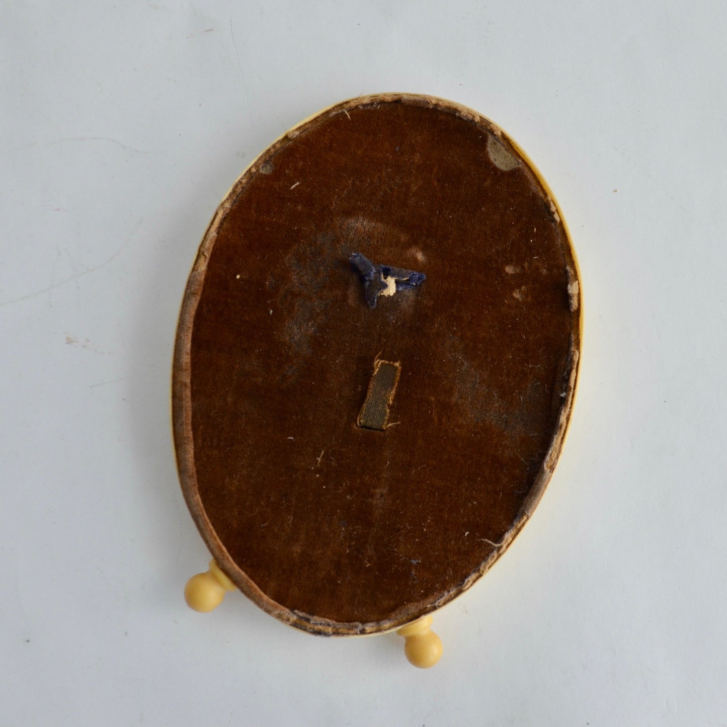 Vintage Celluloid Oval Footed Picture Frame with Antique Photo of Woman in Black Dress