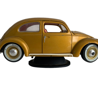 Burago 1955 Gold Volkswagon Beetle Diecast Car with Stand