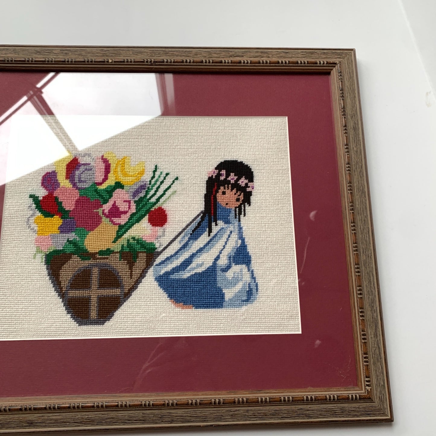 1970’s Framed De Grazia Needlepoint Native Girl with Basket of Flowers 18 x 15.25"