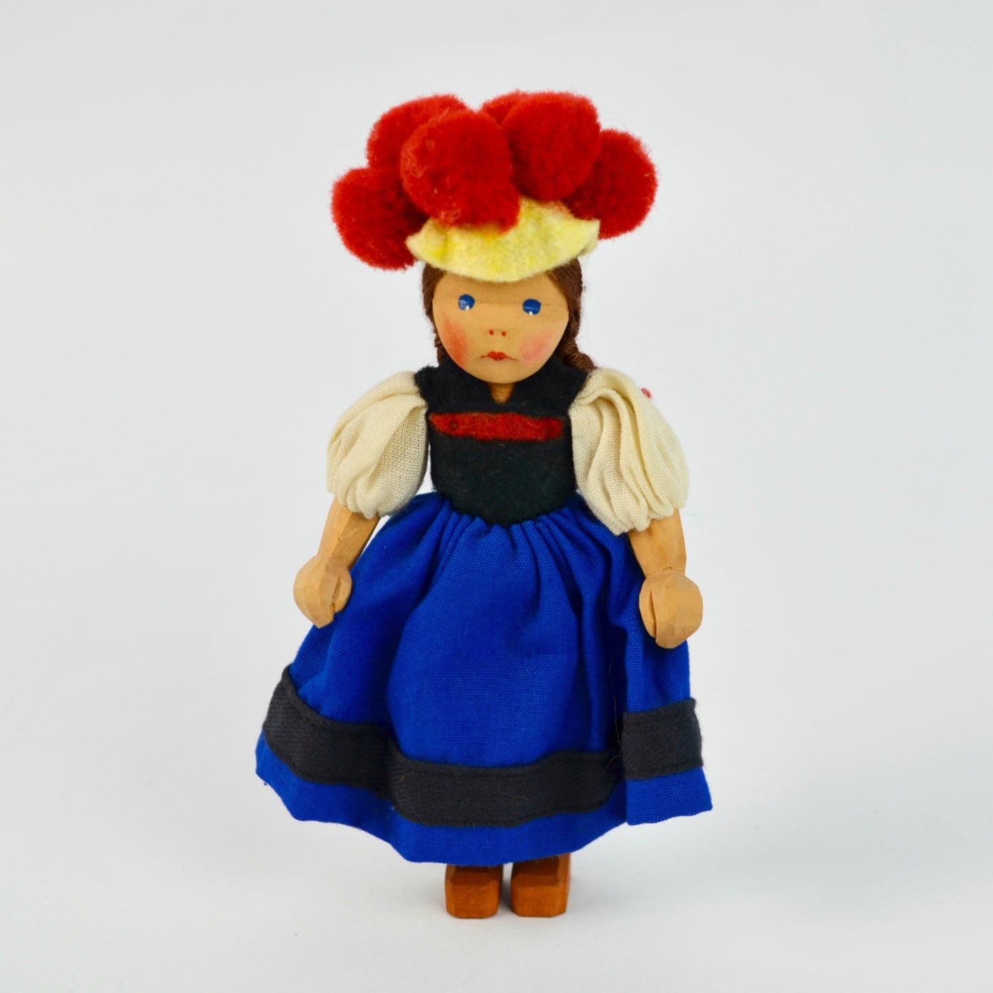 Handcrafted Wooden Doll With Traditional German Black Forest Bollenhut Outfit Red Pom Hat & Braided Hair Blue Dress
